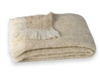 Sand: Hand Brushed Alpaca Throw.  51" x 72". Crafted from naturally occurring colors so no dyes are needed, this Brushed Alpaca Throw is silky soft, naturally repels dirt and retains heat. Alpaca fiber is non-irritating and hypo-allergenic.